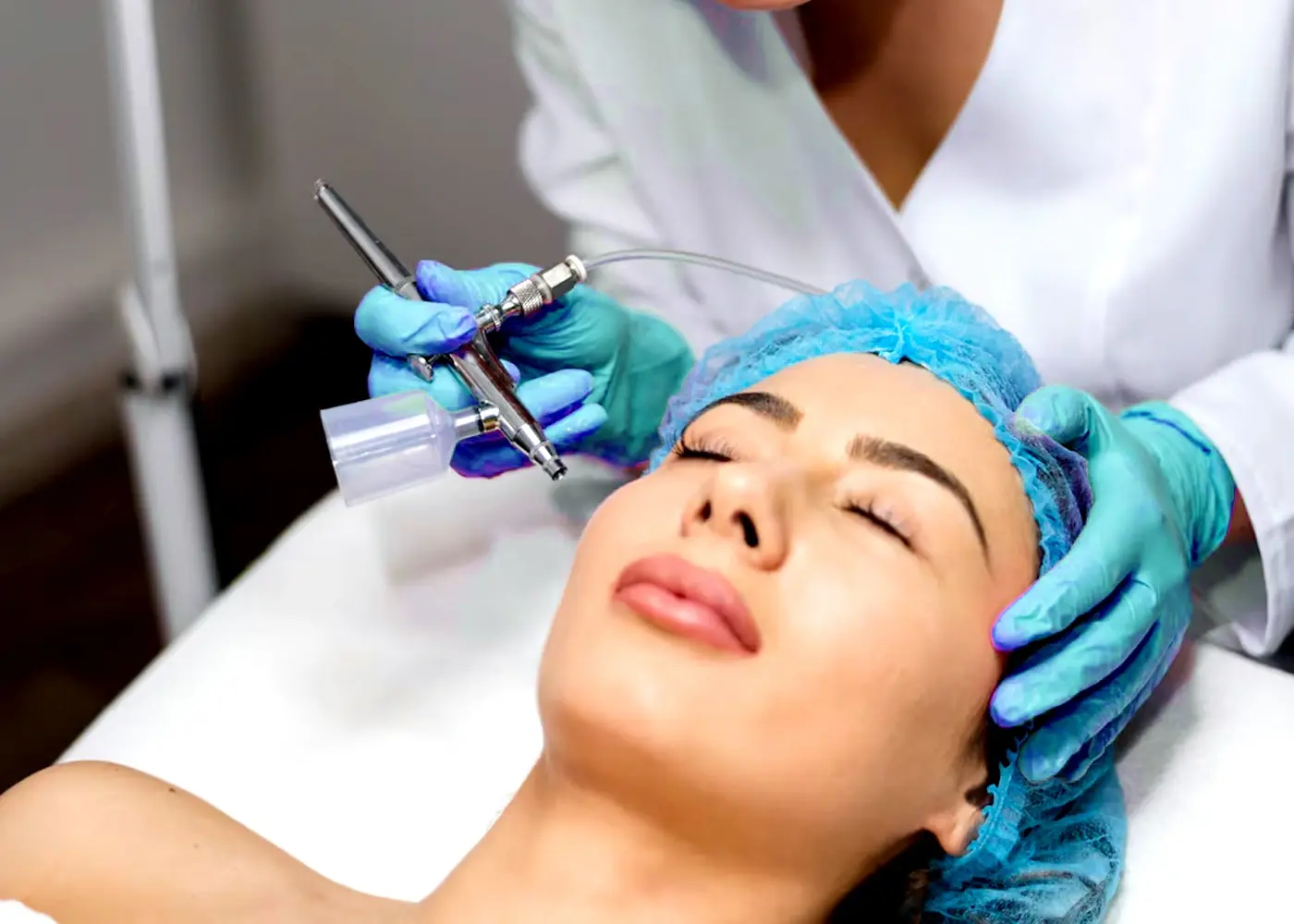 A patient receiving a facial treatment with advanced skincare equipment, showcasing rejuvenation.
